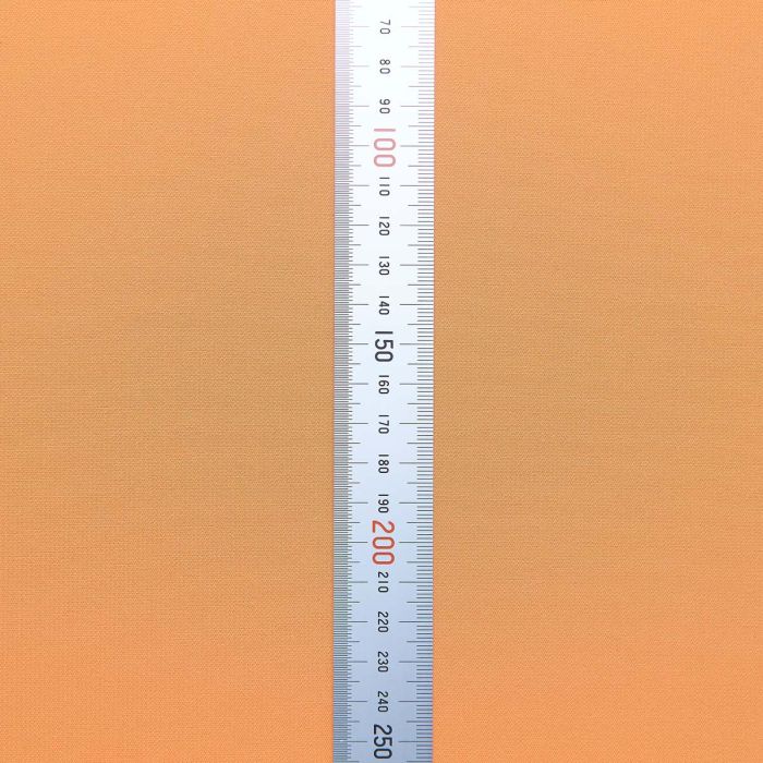 Close-up of ARTISAN ZERO Daidai Orange cloth surface with a measurement ruler